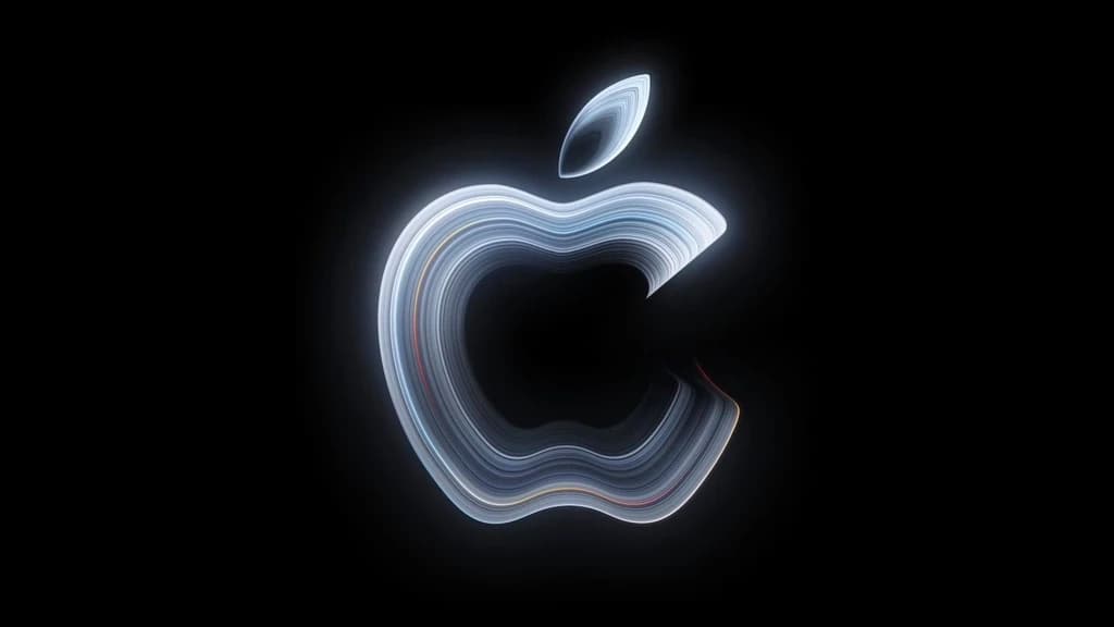 โลโก้ Apple เรืองแสงหลายชั้นบนพื้นดำในทีเซอร์ Pro and Tell